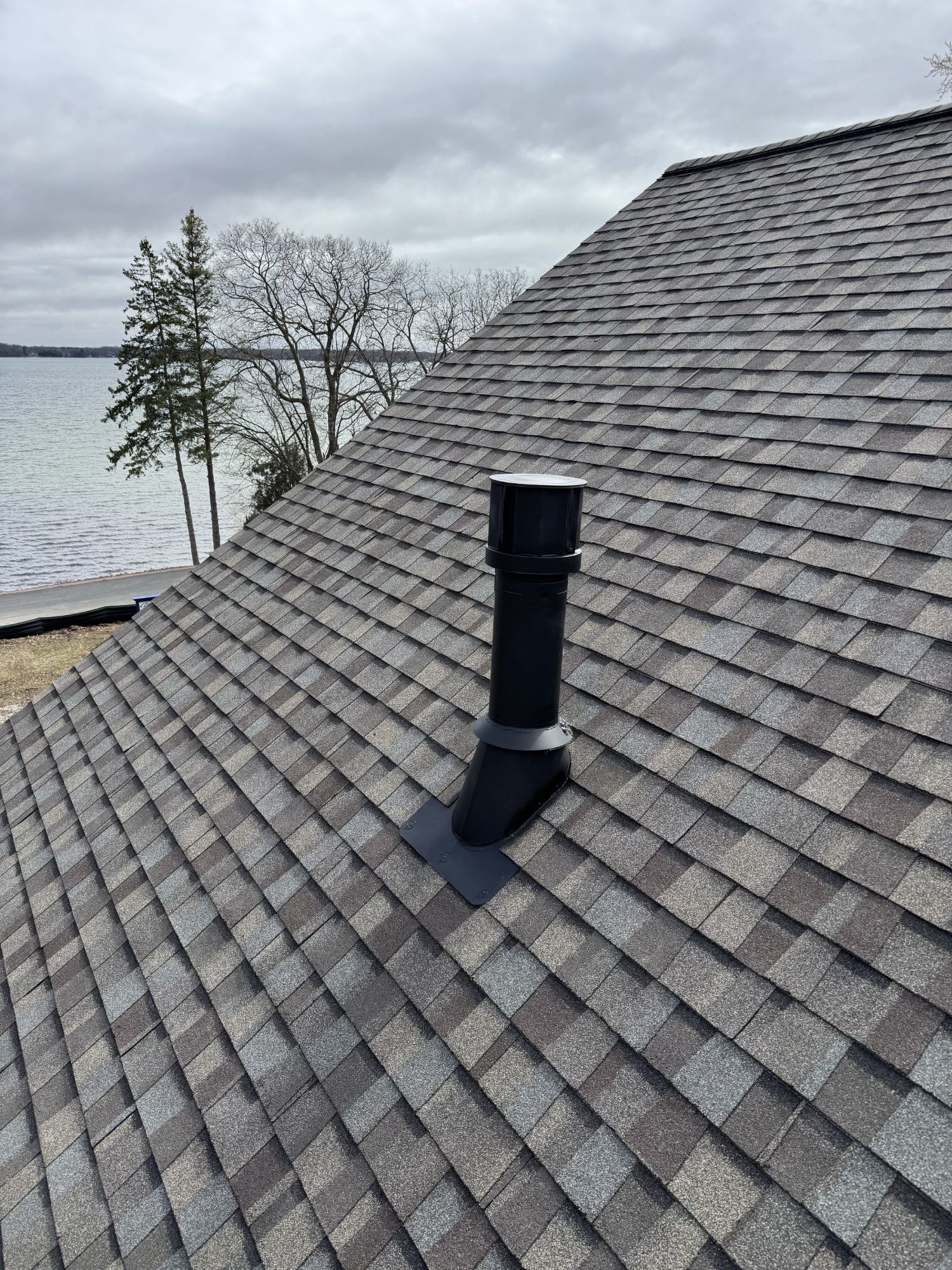 Black chimney cap installation on lakefront property — Dane County WI