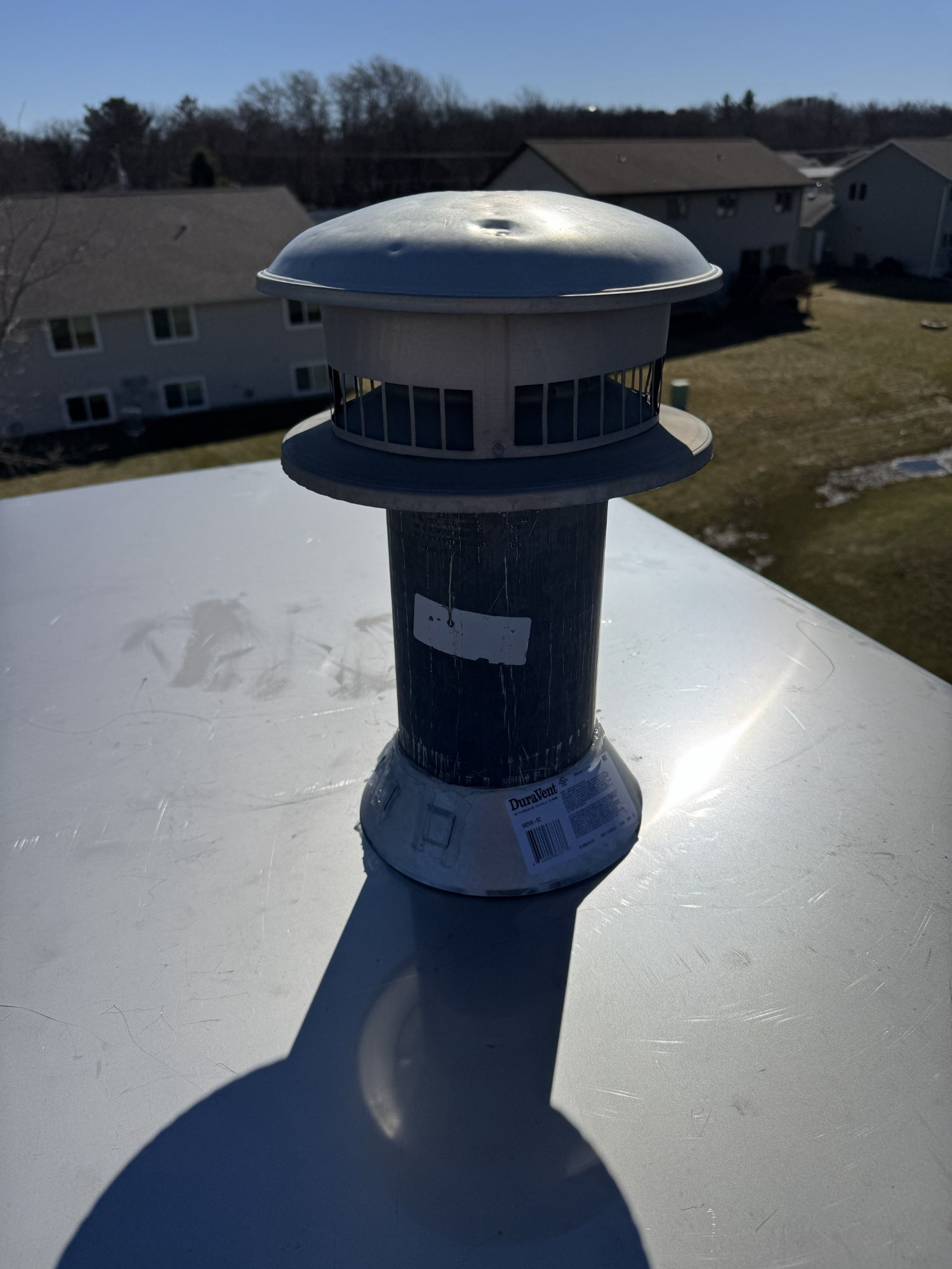 DuraVent chimney cap on custom chase cover — Madison Wisconsin